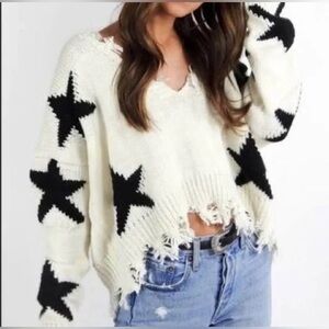 Distressed hem star print pullover sweater in ivory & black medium cropped